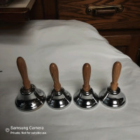 Set of 4 hand bells, white brass with solid oak turned handles
