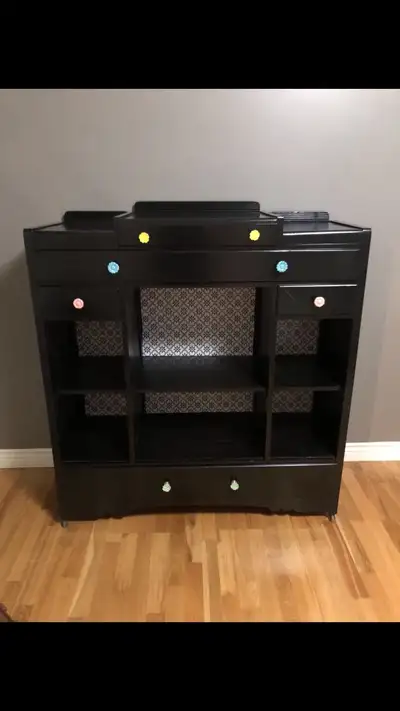 Black cabinet with storage.
