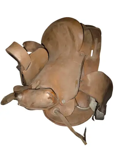 I am selling a used vintage saddle. It is made of real leather and shows signs of wear, which is con...