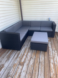Rattan wicker sectional patio set with foot rest/table