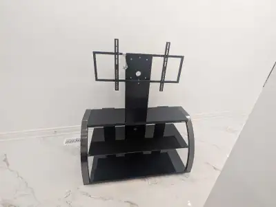 This is a very durable and strong glass & metal TV stand. It has black tempered glass shelves which...