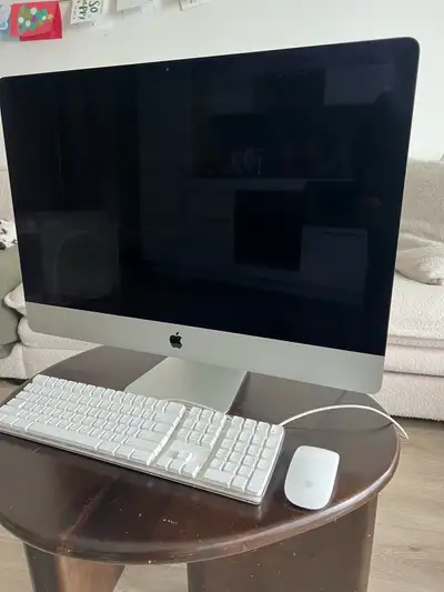 Apple iMac computer, a sleek all-in-one desktop with a vibrant display and reliable performance, per...