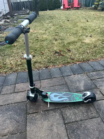 Kids Micro Scooter Green Colour Has a kickstand and adjustable height Not electric
