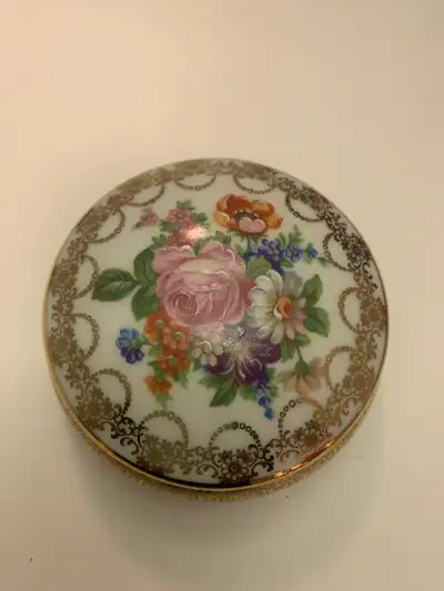 I have this trinket dish that I no longer need. It is in excellent condition and have a floral desig...