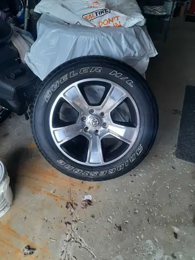 4 Bridgestone Duelers 275/55 R20 and 4 ram factory 20 inch rims excellent quality email for phone
