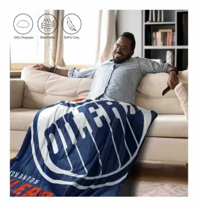 Oilers or Maple Leafs Throw Blanket This 50” x 60” throw blanket is the ideal size for snuggling on...