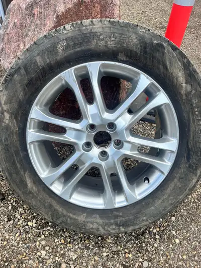 Volvo 18 inch tire and rim. Tire has never been used and the rim has some scrapes and scuffing but i...