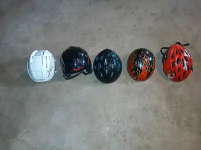 4 kids bike helmets, one skating helmet $60 for all or $15 each