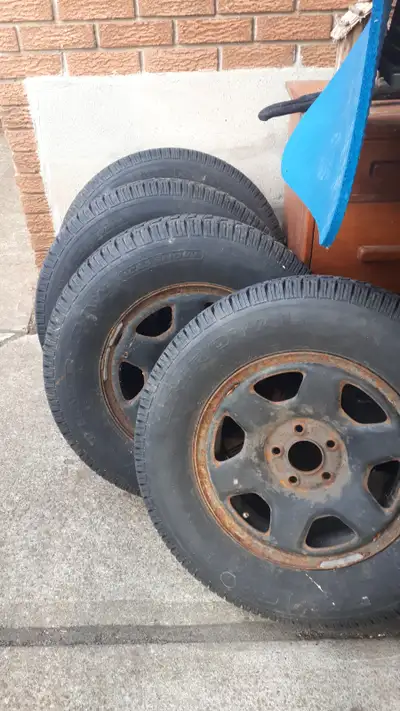 3 Winter Tires / 4 Rims. 235/75R16. Uniroyal Winter Tires. 3 tires are very good, 1 has a nick on si...
