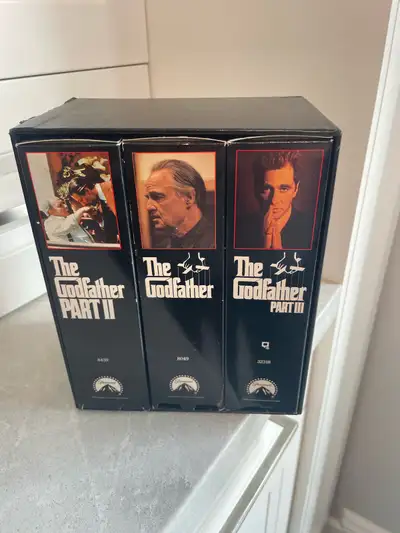 Own the Corleone family saga with The Godfather VHS Trilogy, including Parts I, II, and III! This is...