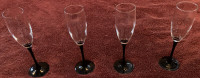 Set of Four (4) Champagne Glasses with Black Stems