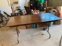 Solid utility folding table