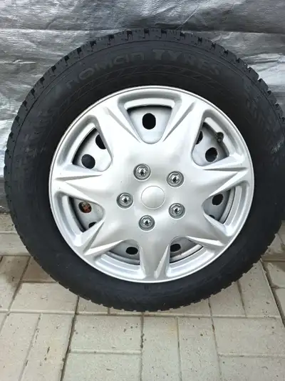 Studded. Only driven 7000 kms with hub caps