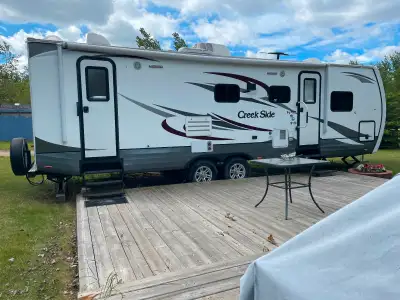 Creek side 27 ft for sale it sat at a campground its entire life now don’t use it enough grandparent...
