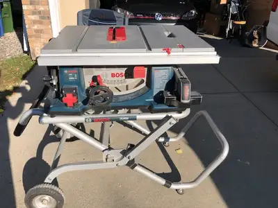Bosch Table Saw model 4100 with Gravity-Rise Wheeled Stand. Fence, mitre gauge, anti-kickback device...