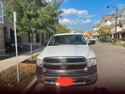 This robust white Dodge RAM 1500 ST pickup truck is ready for anything! This used truck features a p...