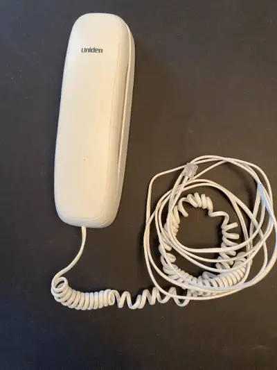Uniden Slimline White Corded Telephone Phone Land Line Model 1100 Works well. Plugs into wall outlet...