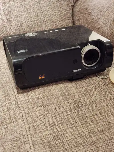 I'm selling a ViewSonic PJ503D DLP projector, perfect for home theaters or presentations, with a bri...