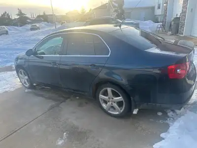 2007 VWjetta 4 door 2L turbo dark blue in color 187000 kms text 7804021091