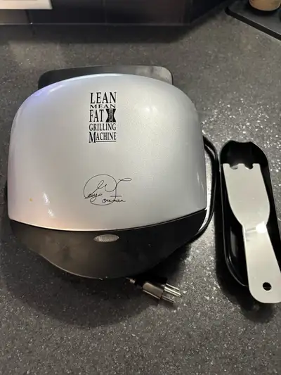 George Foreman grill (small version). Very clean and works like new. Comes with all pieces.