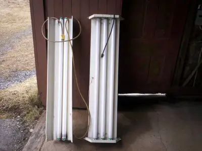 Two - 4' Fluorescent light fixtures, View more