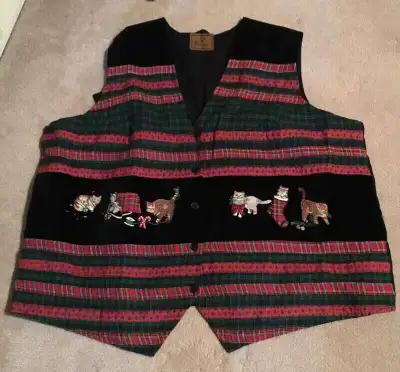 This is for a vintage black button up vest for an ugly Christmas Sweater Party. The vest is velvet e...