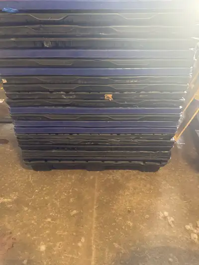 I'm selling a stack of used plastic pallets totes, ideal for moving, storage, or organizing. These s...
