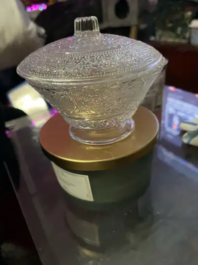 This is a beautiful, decorative glass candy dish with an intricate design, perfect for adding a touc...