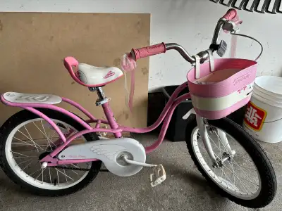 Royal Baby Little Swan girls cruiser bike, 18” wheels. Has hand brake for front wheel and reverse pe...