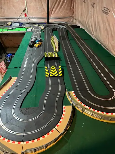 Massive slot car set, includes 4 controllers, start grid, pitstop, lap counter, sideswipe, ramps, va...