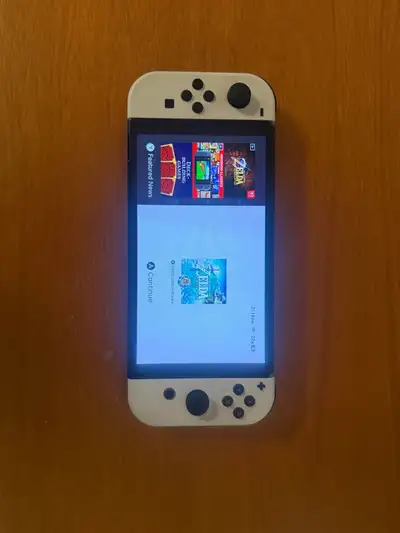 Nintendo switch oled, pro controller and 2 games, View more