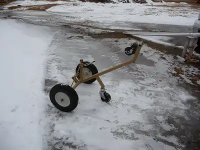 Move your snowmobile or boat trailer into the garage with ease. Fasten the cable to the end of the g...