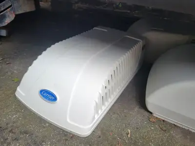 2 used rv ac shrouds, 1 is a Carrier. Fits carrier 13,500 btu ac unit. The other is a Coleman mach 1...