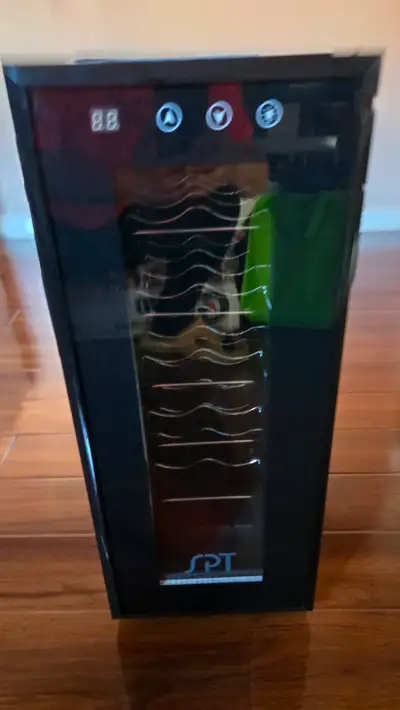 Almost new wine cooler. Asking 50cad., View more