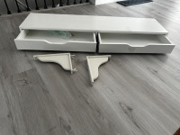 White IKEA desk with L brackets to mount on wall