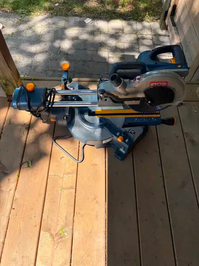 Ryobi sliding compound miter saw 10-inch model featuring a blue and gray design.It is equipped with...