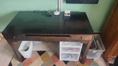 This solid wooden desk and accompanying adjustable desk chair are in great shape and are a great pla...