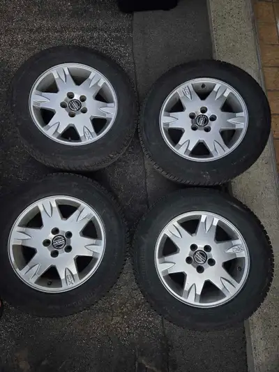 Set of 4 Volvo XC70 mags with mounted Continental Vikingcontact 7 tires. 215 65 r16. 8/32 left.