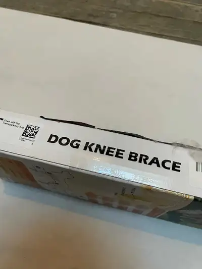 New dog knee brace. Size large. Black neoprene material. Provides support and cushioning for canine...