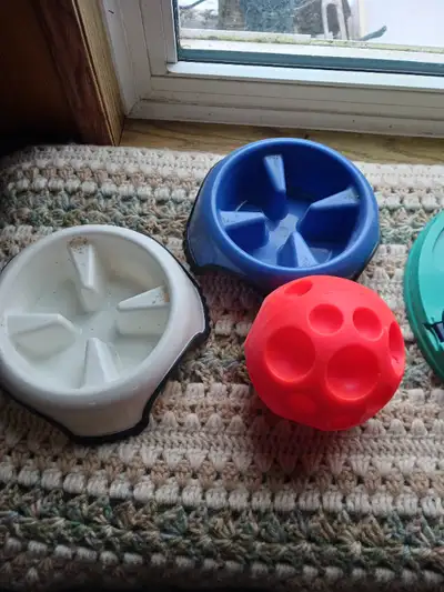 2 slow down dog bowls. $10 ea 1 tricky treat ball. $10 1 slow down play mat. $20 1 find the treat tr...