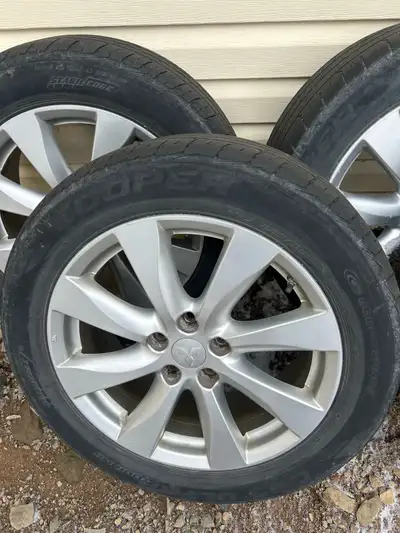 4 Cooper all season tires on Mitsubishi 18” rims. Tires are worn but could get another summer out of...