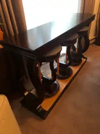 Decorative table with three stools