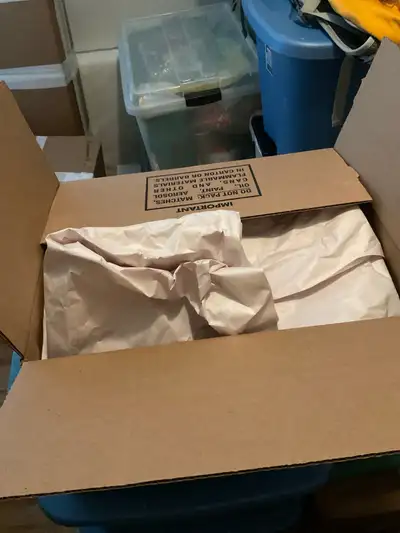Moving boxes and paper in the market area, View more