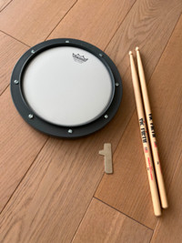 Remo Practice Drum Pad + Drum sticks