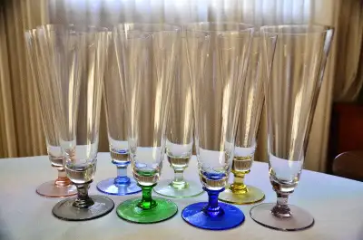 Selling 8 beautiful subtlety colored stemware; much like crystal in "sound".. Originally sold as "be...