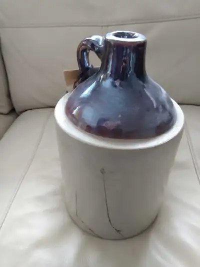 Stoneware Jug with some hair line cracks as pictured, measures - 10 inches high x 6 inches diameter....
