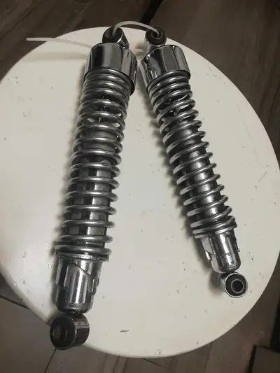 Selling a pair of chrome motorcycle shock absorbers. Condition is good, with some minor scuffs. Grea...