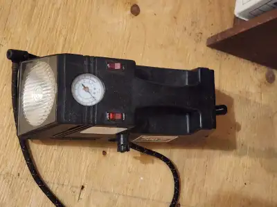 Car air compressor has light also