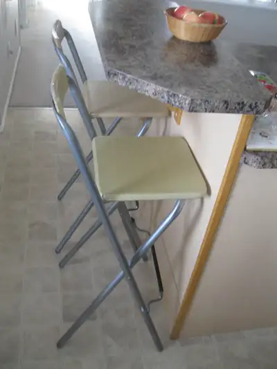 Pair of folding kitchen counter or tall bar stools complete with chair backs are perfect for high ta...