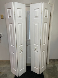 Two bifold closet doors 